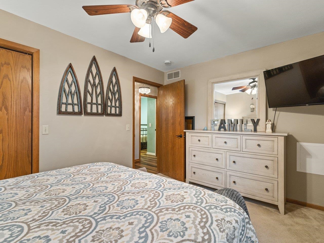1816 Post Road Beloit, WI 53511 - Photo 20 of 42 a bedroom with a bed and a flat screen tv