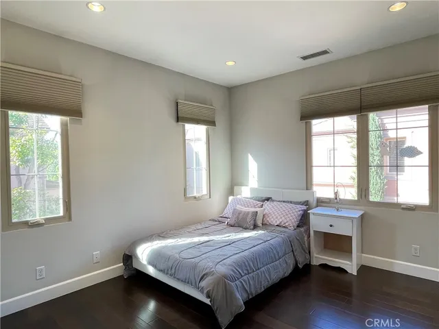 a bed room with a bed and a window