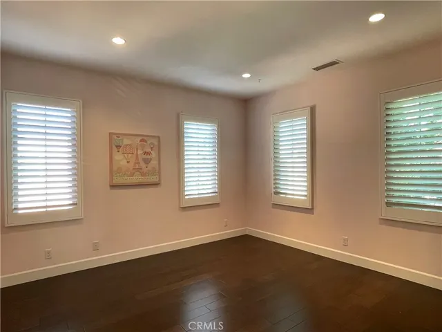 a kitchen with a table chairs stove and cabinets