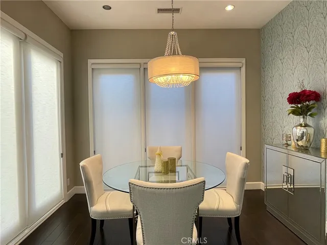 a view of a kitchen with white cabinets