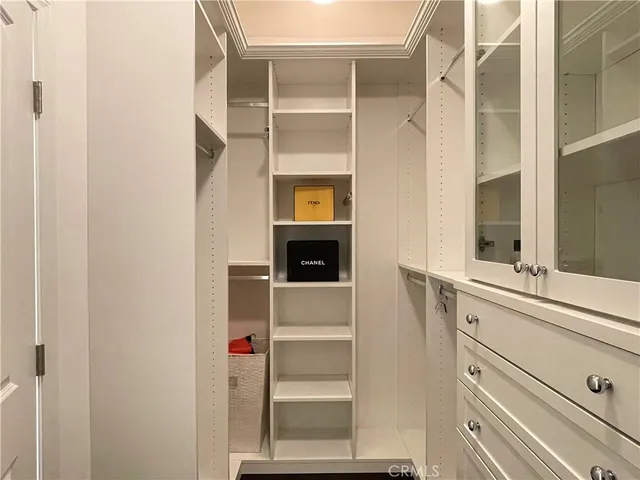 a bathroom with a tub a sink and mirror