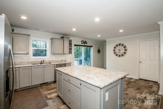 a view of room with window and a ceiling fan