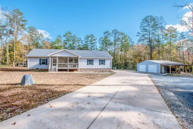 a balcony with furniture and a potted plant