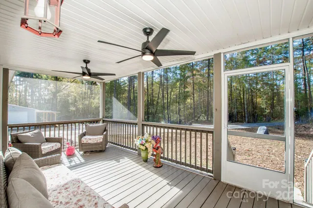 a room with gym equipment and windows