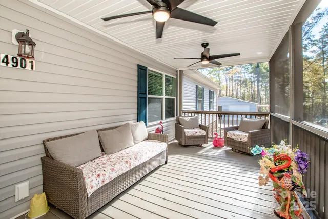 a bathroom with a granite countertop sink a toilet and a shower