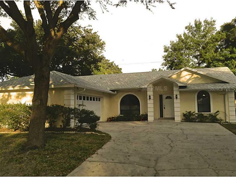 1961 Pinehurst Road Dunedin, FL 34698 - Photo 1 of 1 a view of a yard in front of house