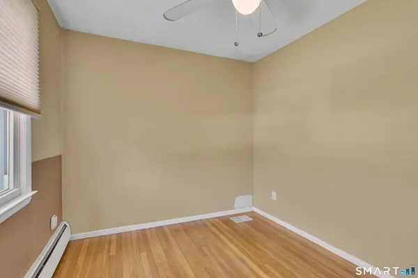 a view of small space with wooden floor