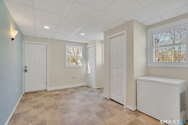 a view of an empty room with a window