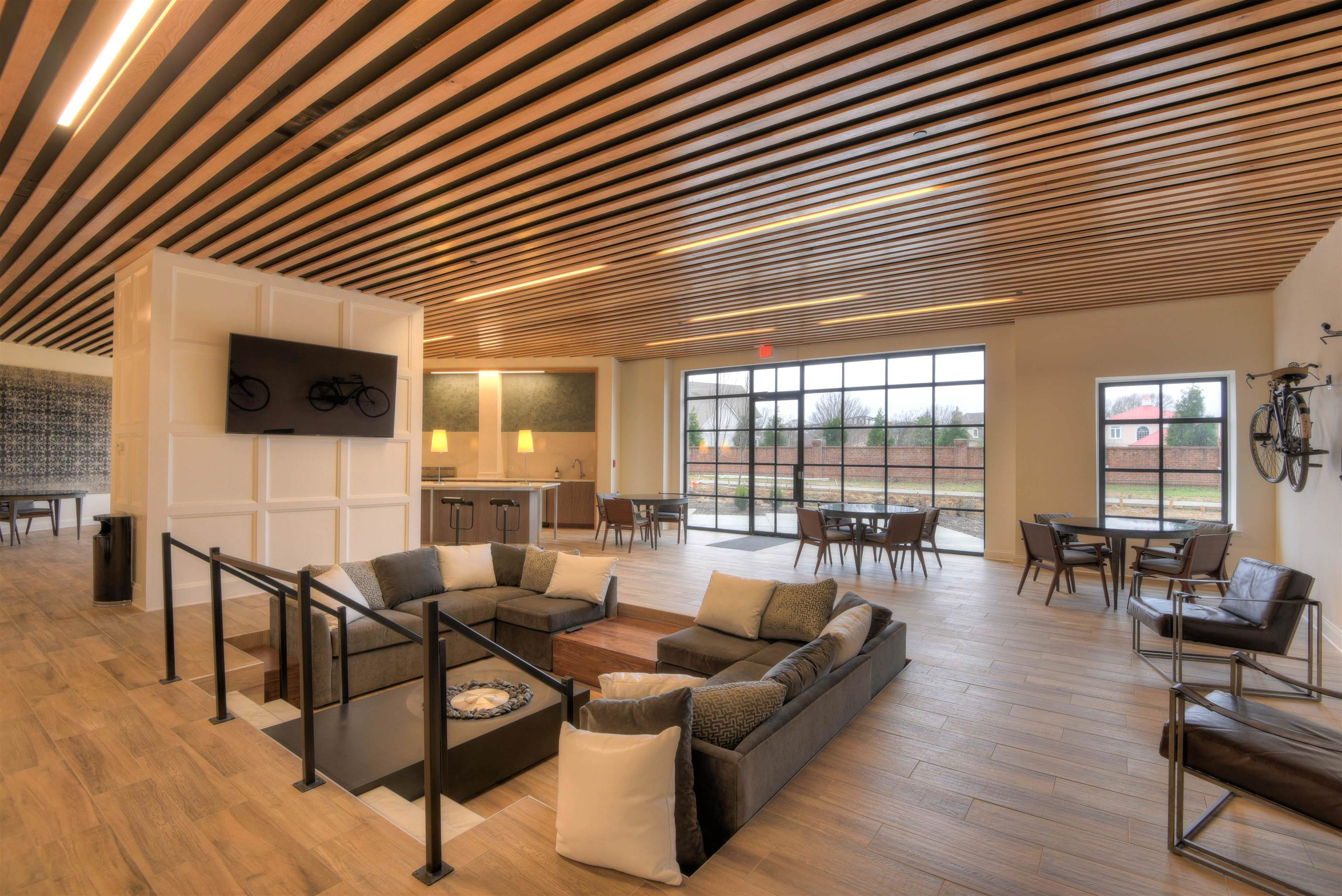 717 Riverside Drive, Unit 1506 Memphis, TN 38103 - Photo 28 of 38 a living room with furniture and a flat screen tv