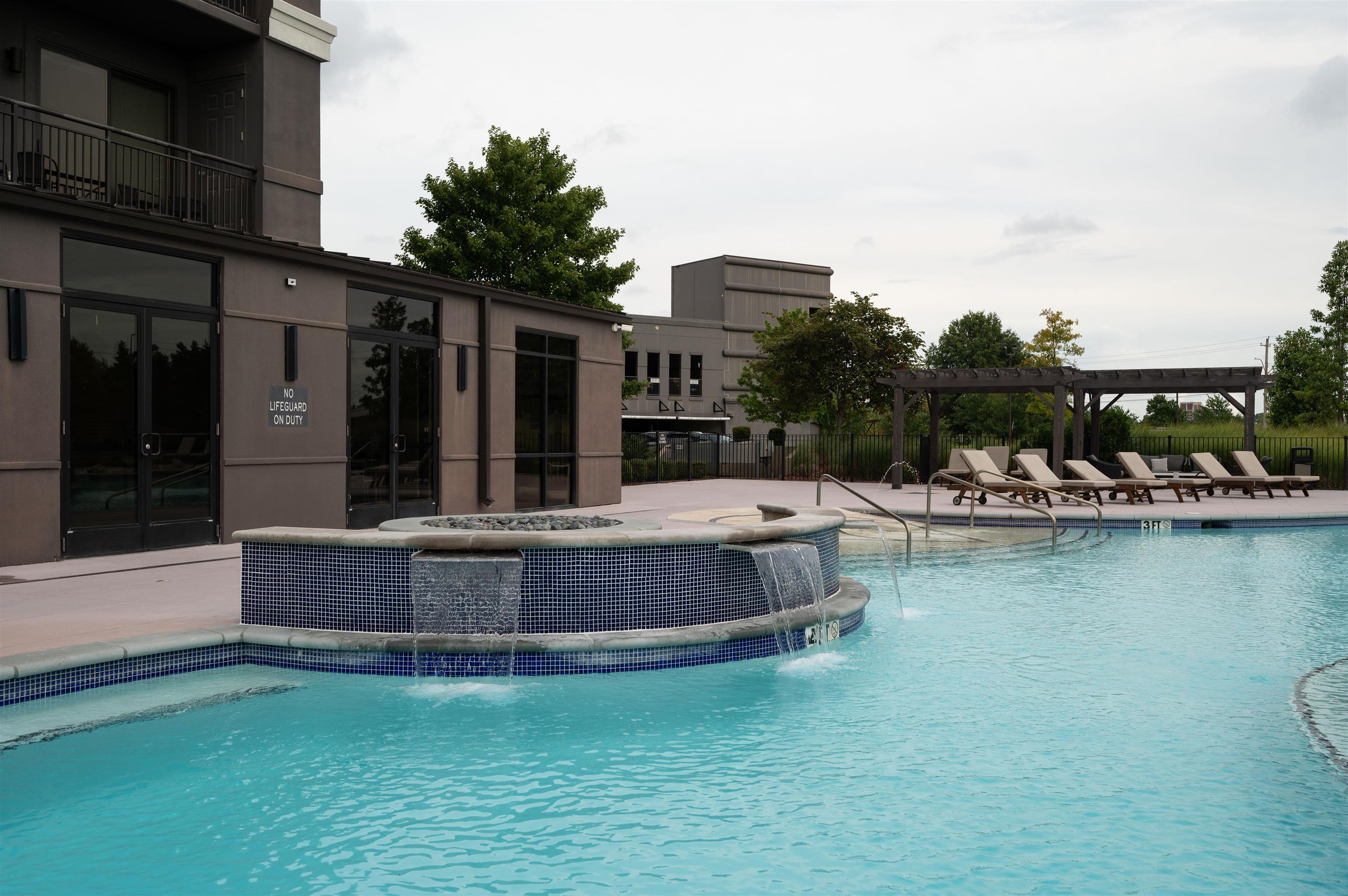 717 Riverside Drive, Unit 1506 Memphis, TN 38103 - Photo 36 of 38 a view of swimming pool with outdoor seating and lake view