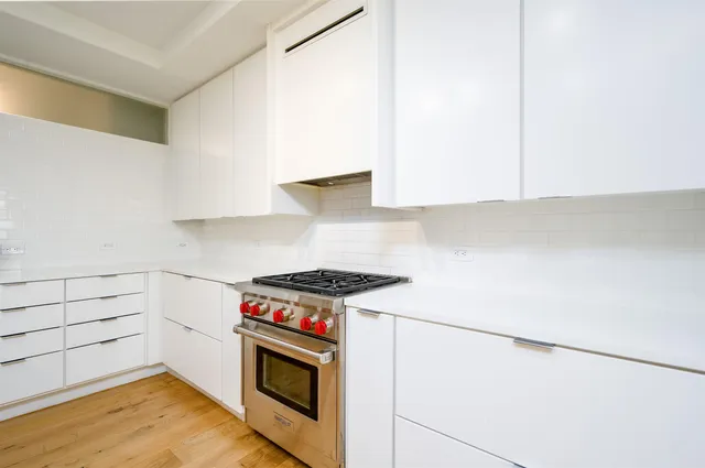 a kitchen with a stove and a microwave