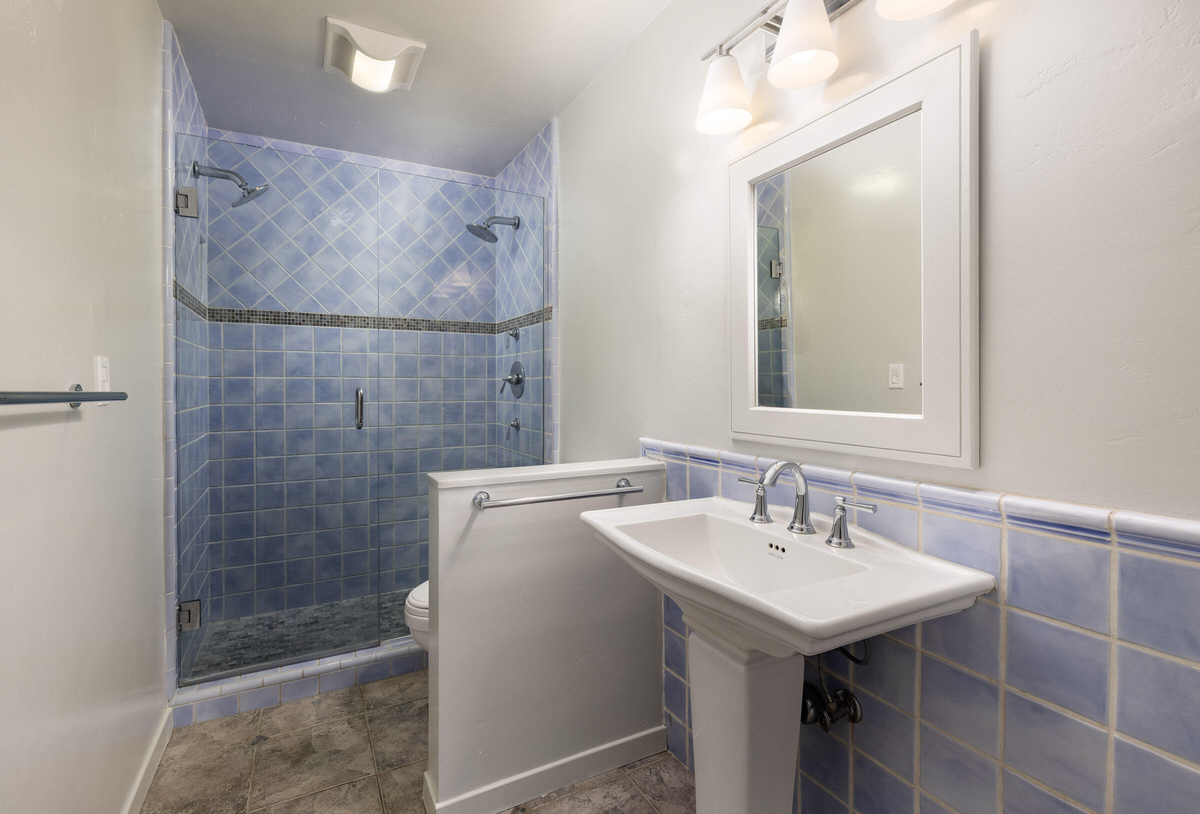 3375 Foothill Road, Unit 232 Carpinteria, CA 93013 - Photo 11 of 17 a bathroom with a sink mirror and shower