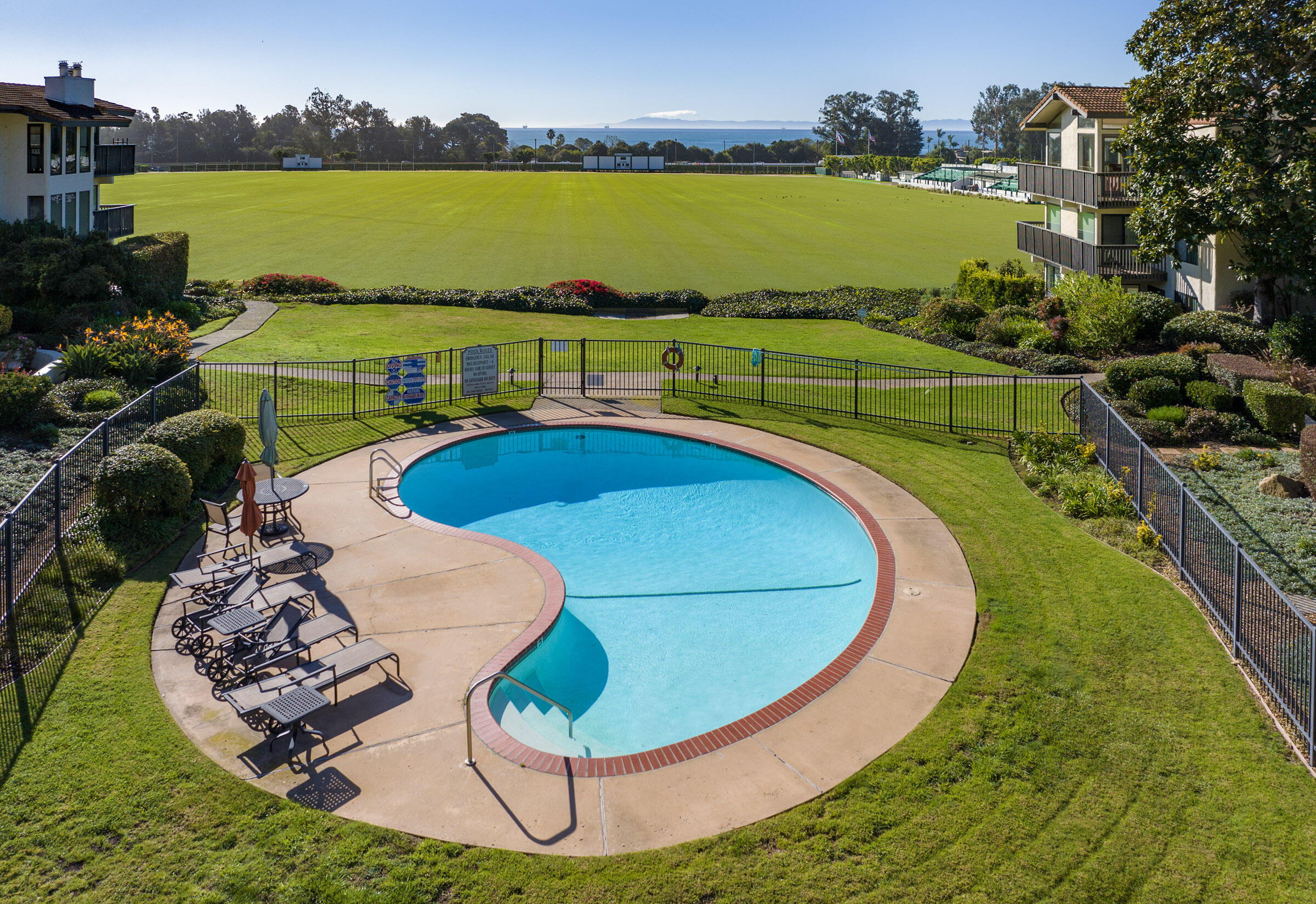 3375 Foothill Road, Unit 232 Carpinteria, CA 93013 - Photo 12 of 17 a view of a swimming pool with a lake
