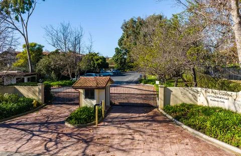 a view of a street with benches in the background