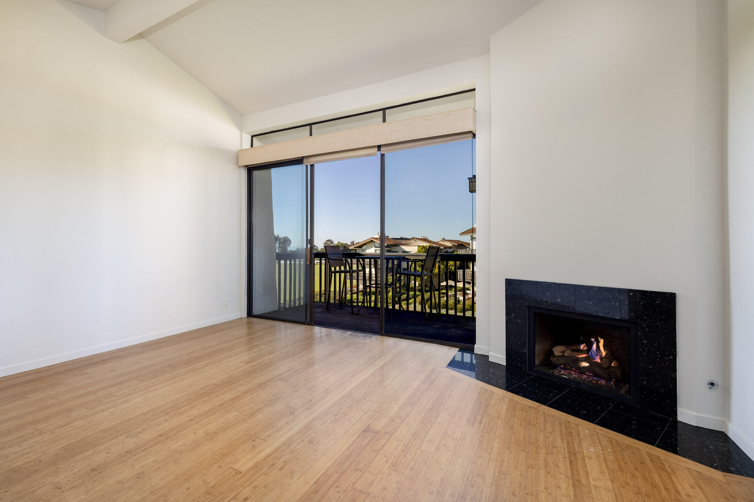 3375 Foothill Road, Unit 232 Carpinteria, CA 93013 - Photo 2 of 17 a view of an empty room with a fireplace and a window