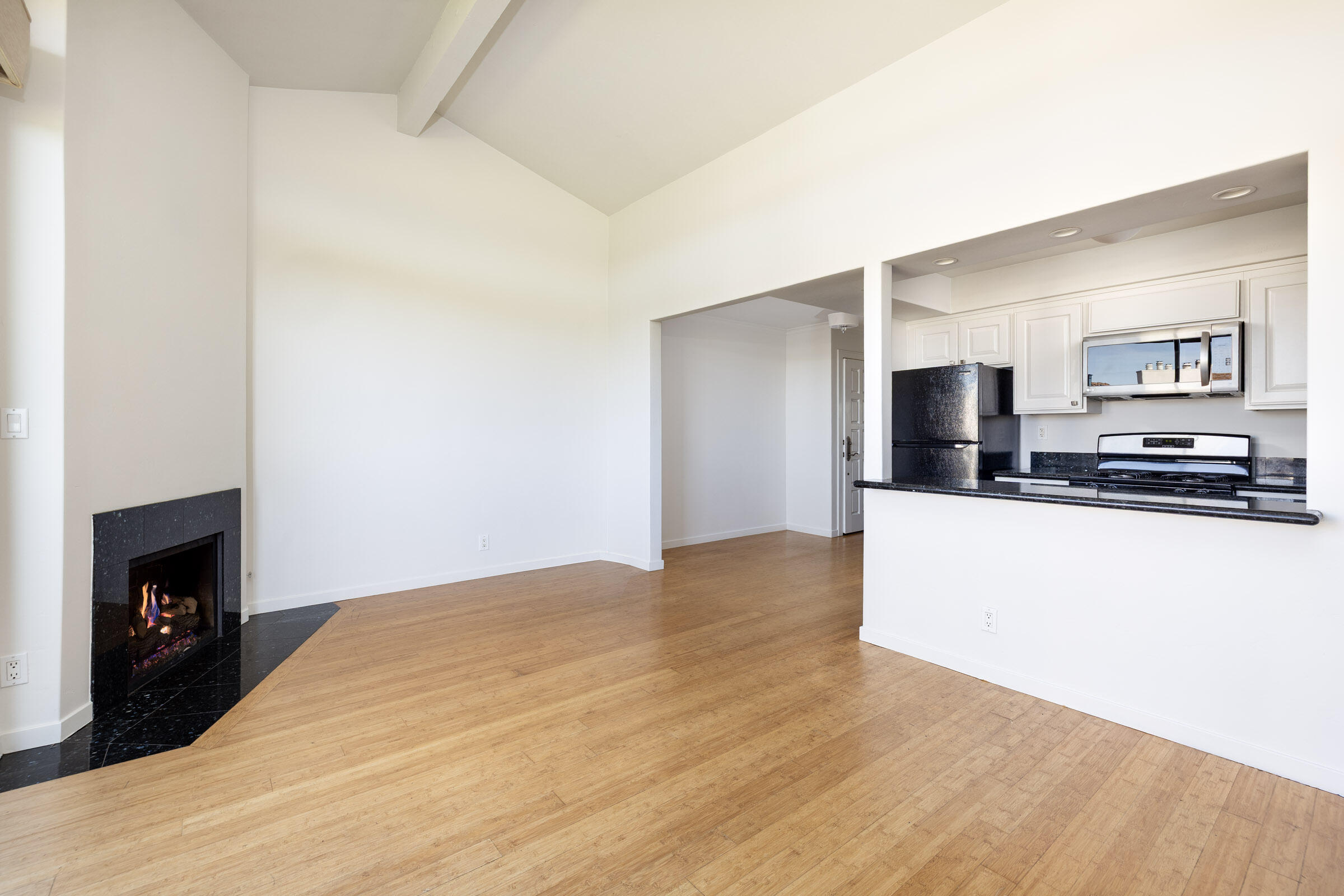 3375 Foothill Road, Unit 232 Carpinteria, CA 93013 - Photo 6 of 17 a living room with stainless steel appliances kitchen island a fireplace