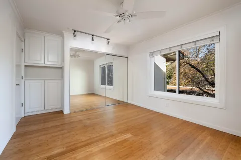 a bathroom with a sink mirror and shower