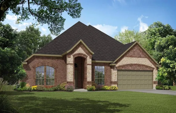 a front view of a house with a yard and trees
