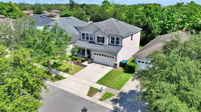 a aerial view of a house with a yard