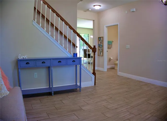 a view of a hallway with staircase