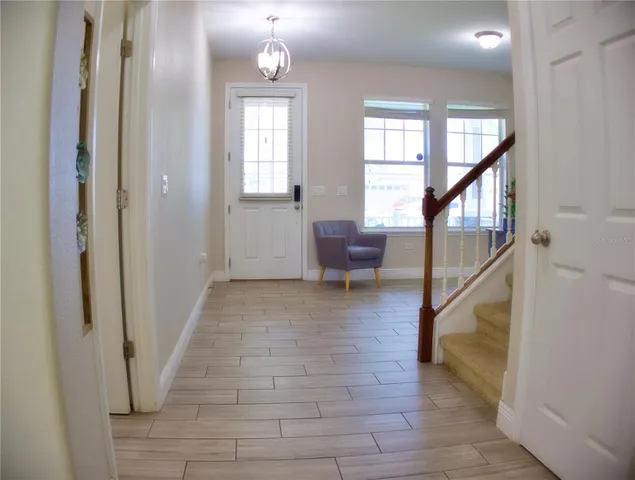 a view of entryway and hall with a rug