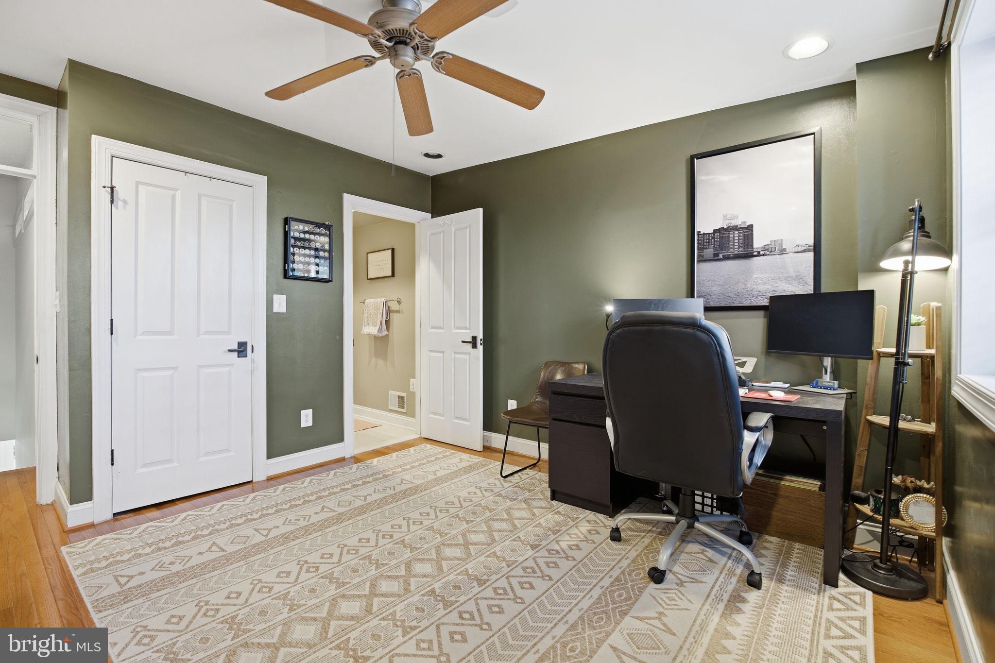 3312 Fleet Street Baltimore, MD 21224 - Photo 16 of 26 a view of a workspace with furniture and a window