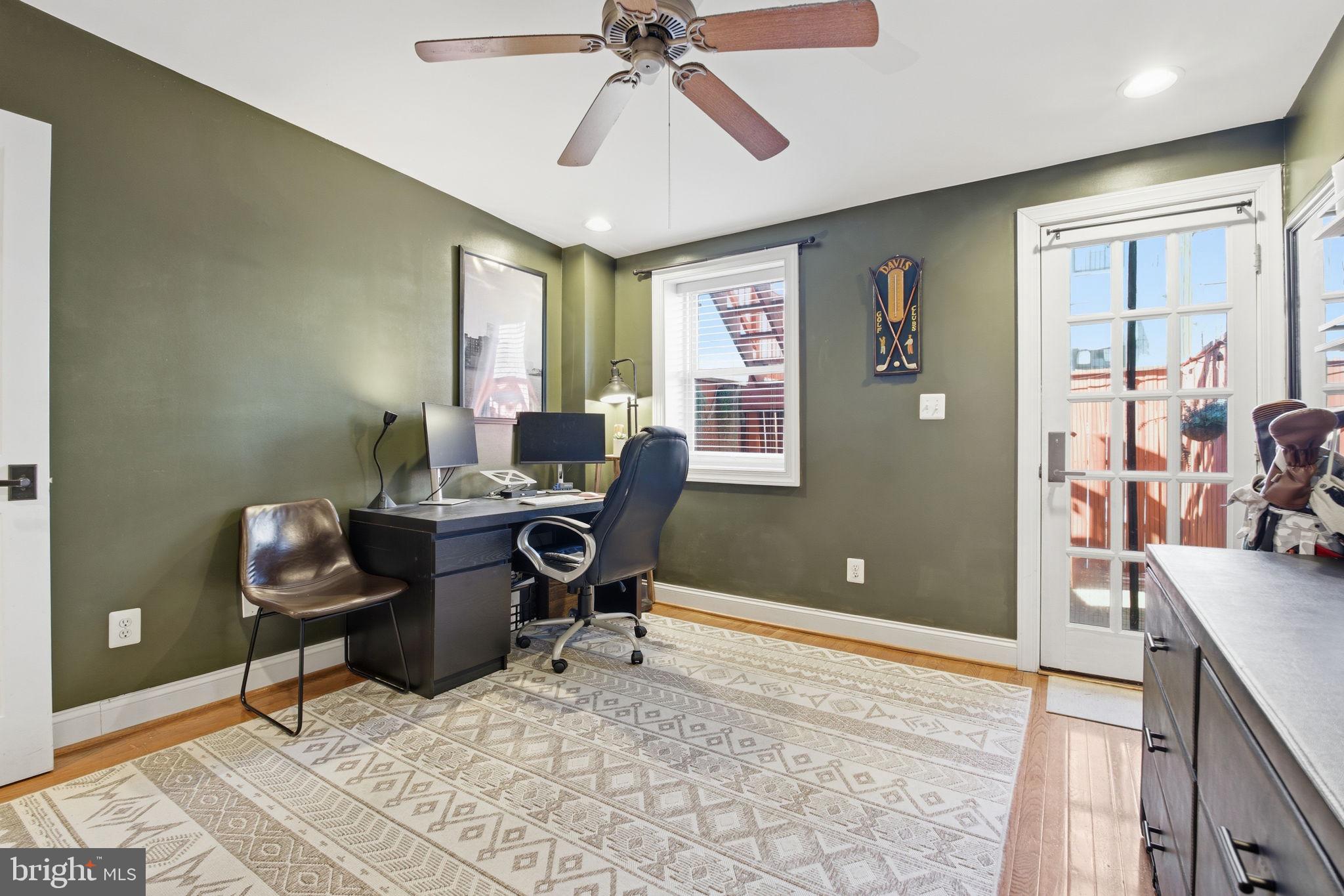 3312 Fleet Street Baltimore, MD 21224 - Photo 17 of 26 a view of a workspace with furniture and a window