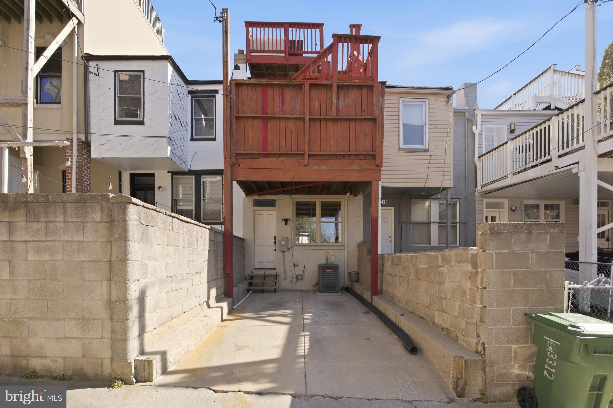 3312 Fleet Street Baltimore, MD 21224 - Photo 26 of 26 a view of a brick house with large windows