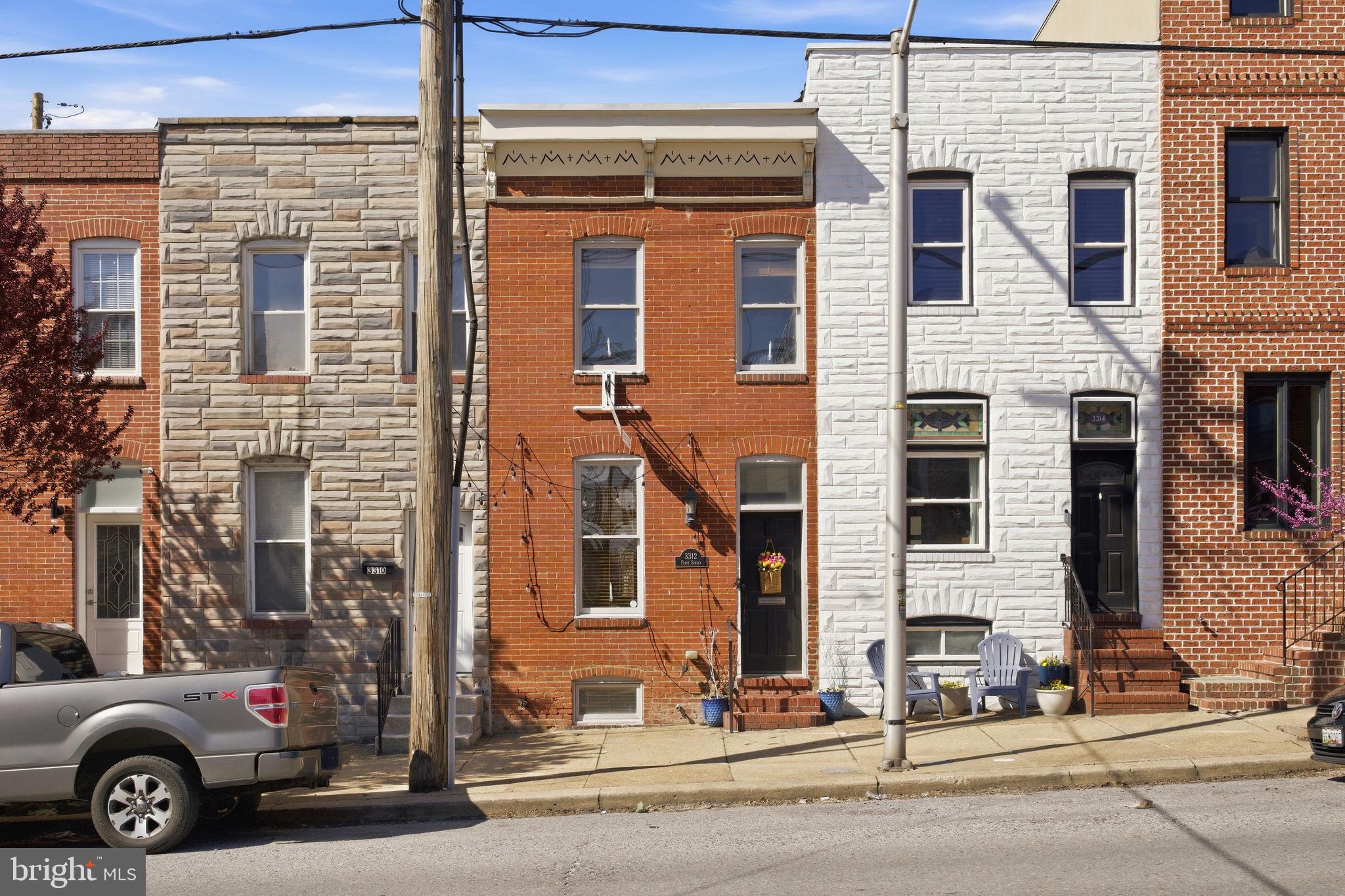 3312 Fleet Street Baltimore, MD 21224 - Photo 3 of 26 a view of a car park in front of a building