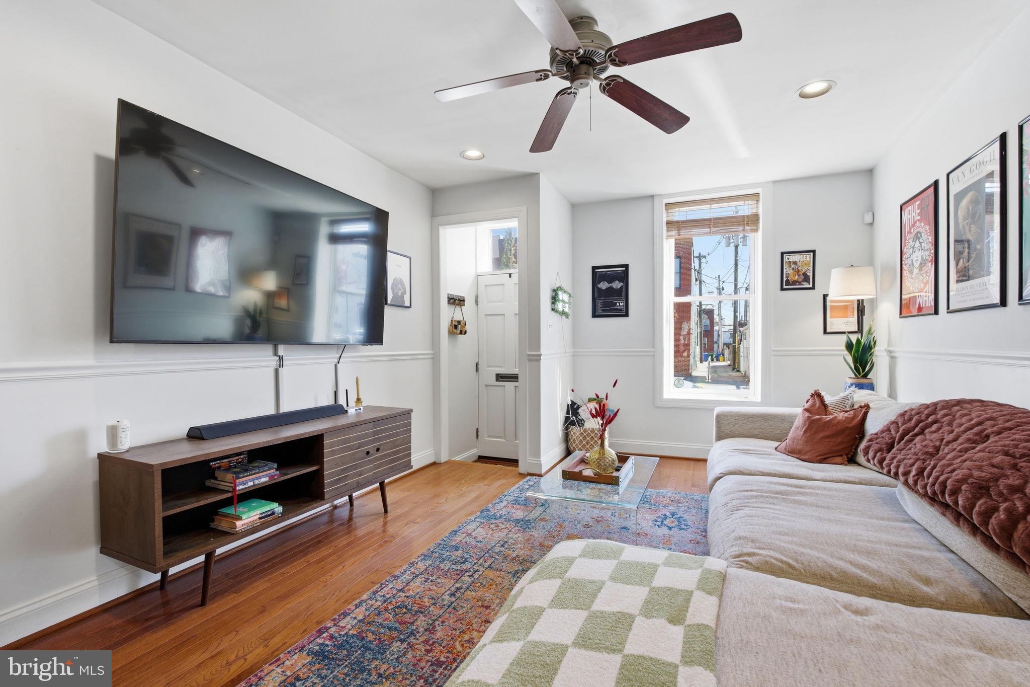 3312 Fleet Street Baltimore, MD 21224 - Photo 4 of 26 a living room with furniture and a flat screen tv