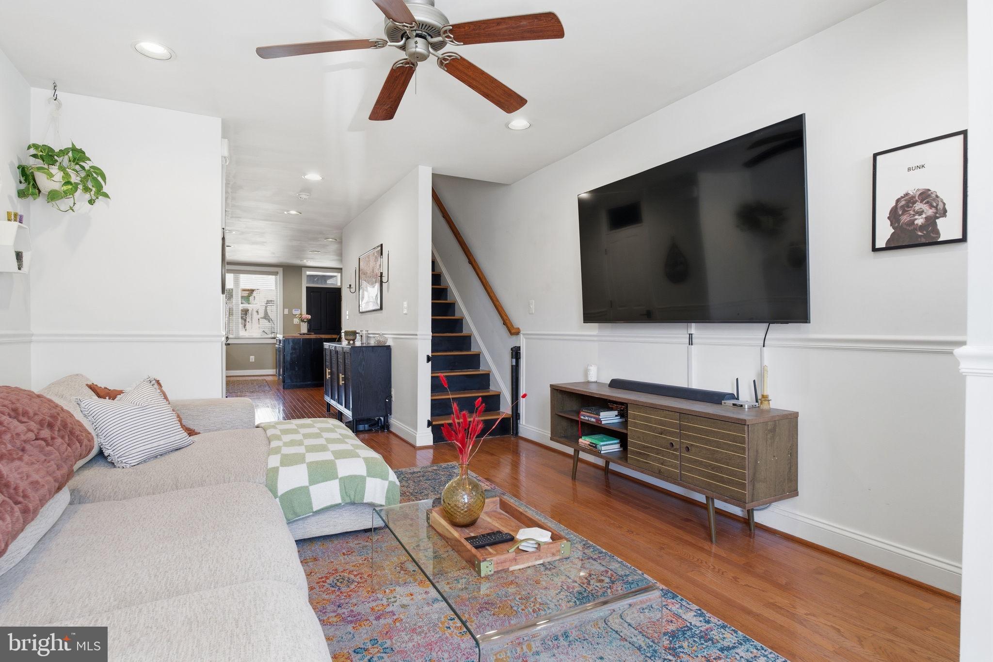3312 Fleet Street Baltimore, MD 21224 - Photo 6 of 26 a living room with furniture and a flat screen tv