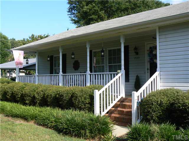1723 Bahama Road Bahama, NC 27503 - Photo 2 of 14 a view of a house with deck and garden