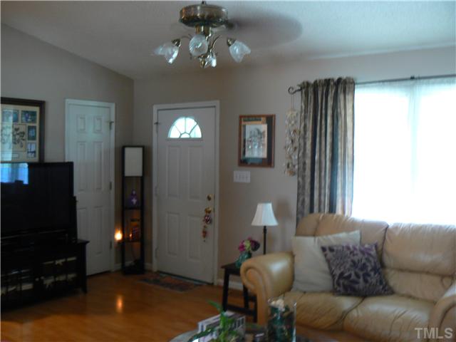 1723 Bahama Road Bahama, NC 27503 - Photo 6 of 14 a living room with furniture and a flat screen tv
