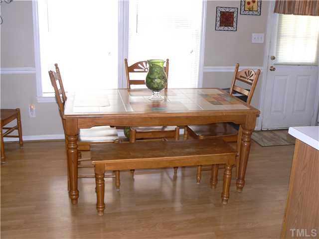 1723 Bahama Road Bahama, NC 27503 - Photo 9 of 14 a view of a dining room with furniture and wooden floor