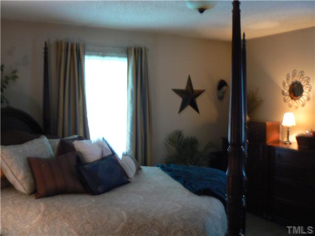 1723 Bahama Road Bahama, NC 27503 - Photo 10 of 14 a bedroom with a bed and a window