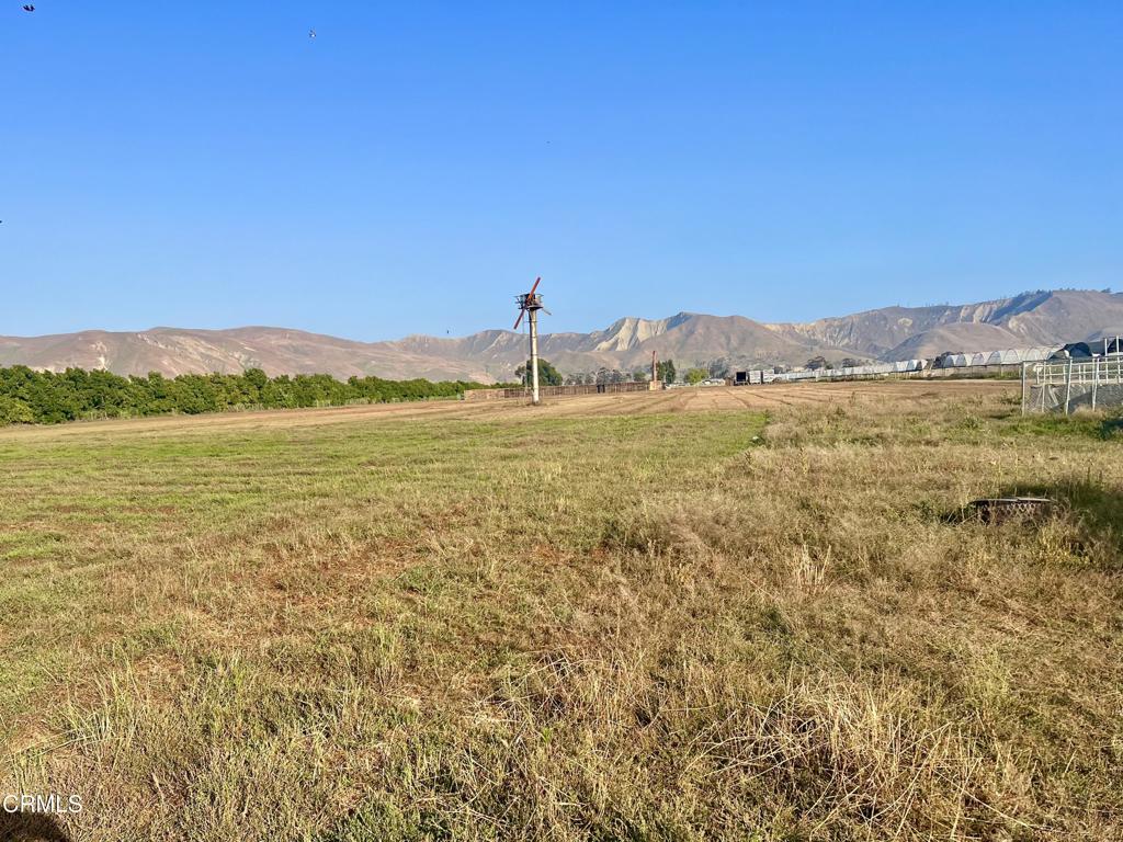 a view of an ocean and a mountain