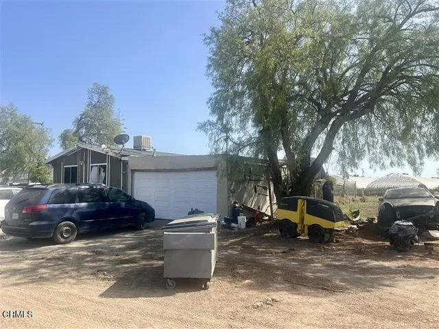 a view of a patio with a yard