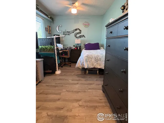 a spacious bathroom with a sink and a mirror