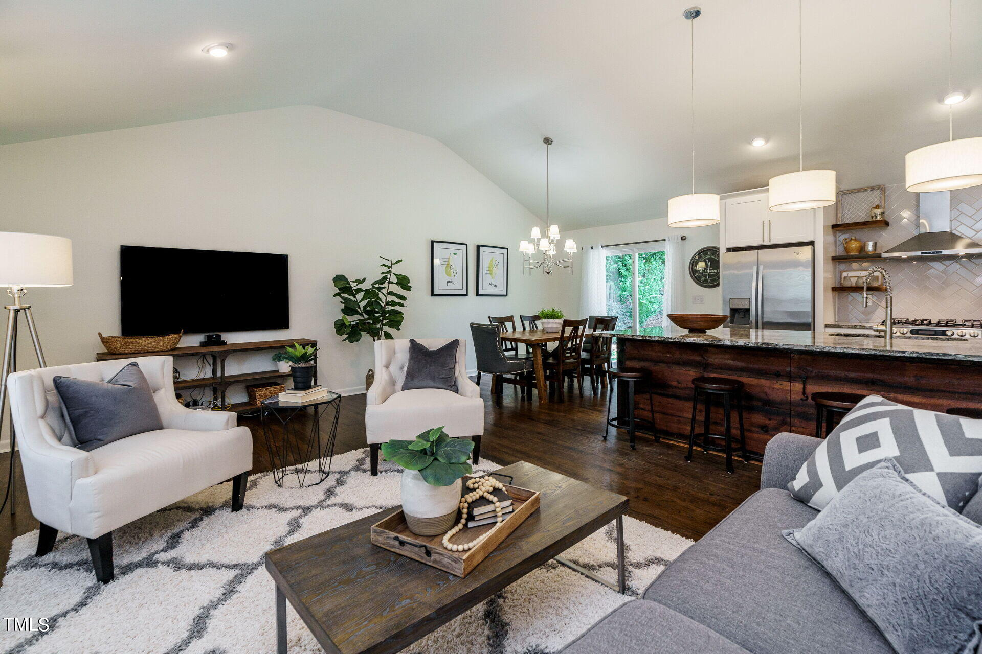 318 Glen Valley Road Raleigh, NC 27609 - Photo 1 of 39 a living room with furniture and a flat screen tv