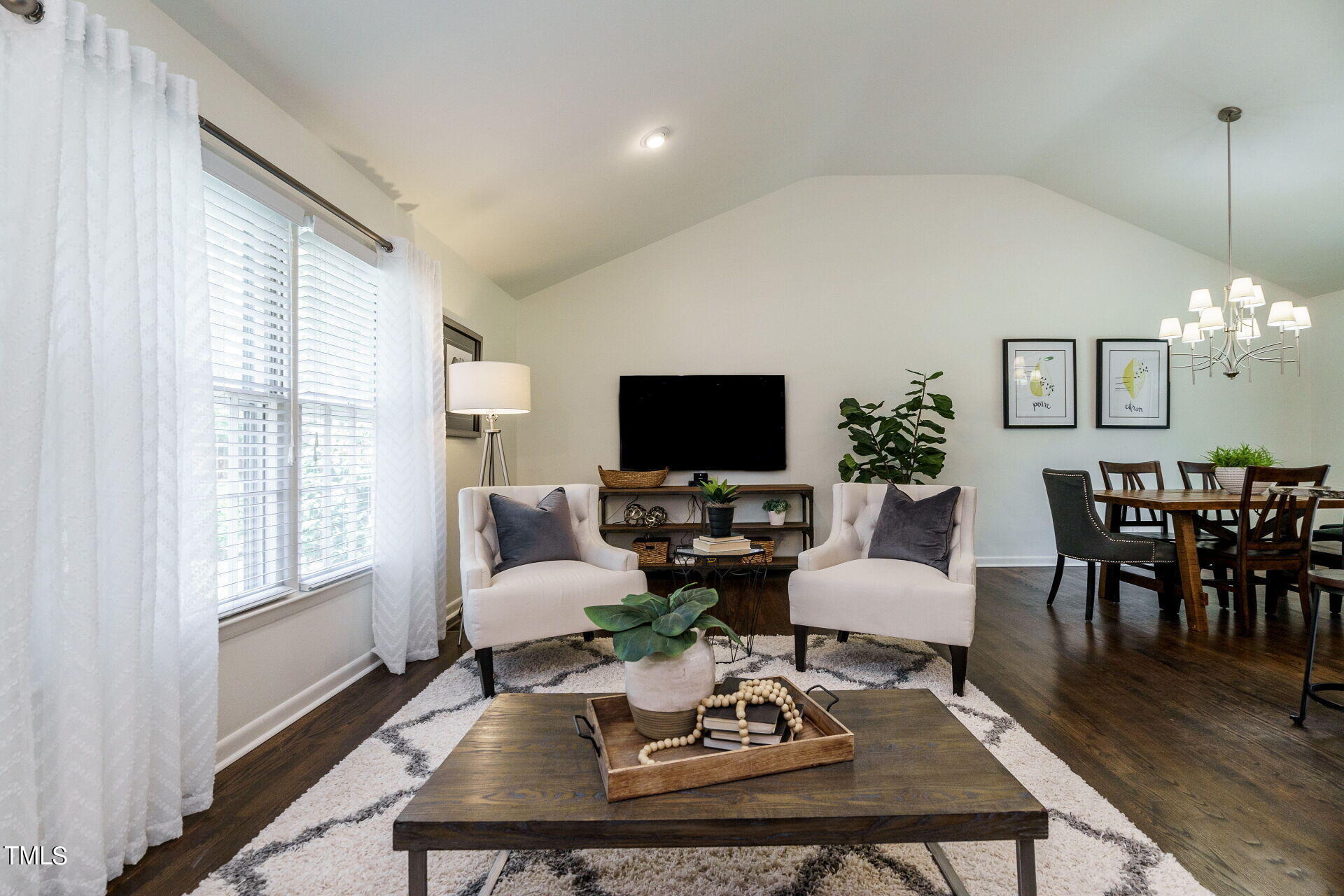 318 Glen Valley Road Raleigh, NC 27609 - Photo 2 of 39 a living room with furniture a dining table and a potted plant