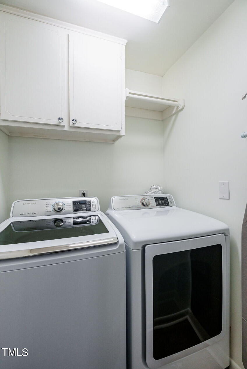 318 Glen Valley Road Raleigh, NC 27609 - Photo 25 of 39 a utility room with dryer and washer