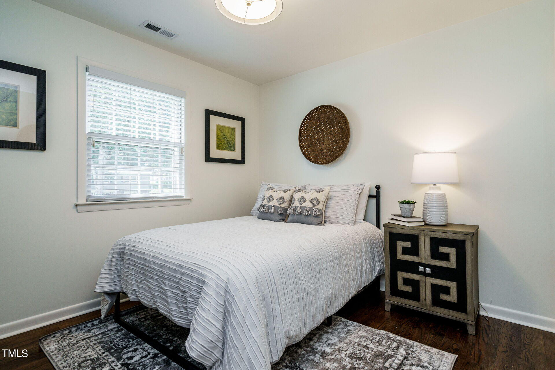 318 Glen Valley Road Raleigh, NC 27609 - Photo 30 of 39 a bedroom with a bed and a window