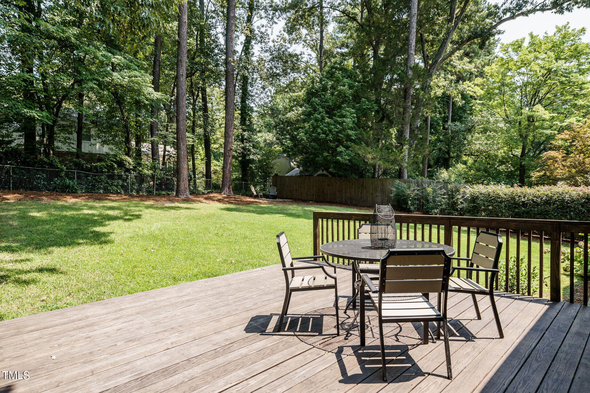 318 Glen Valley Road Raleigh, NC 27609 - Photo 33 of 39 a view of a chair and table on the wooden floor
