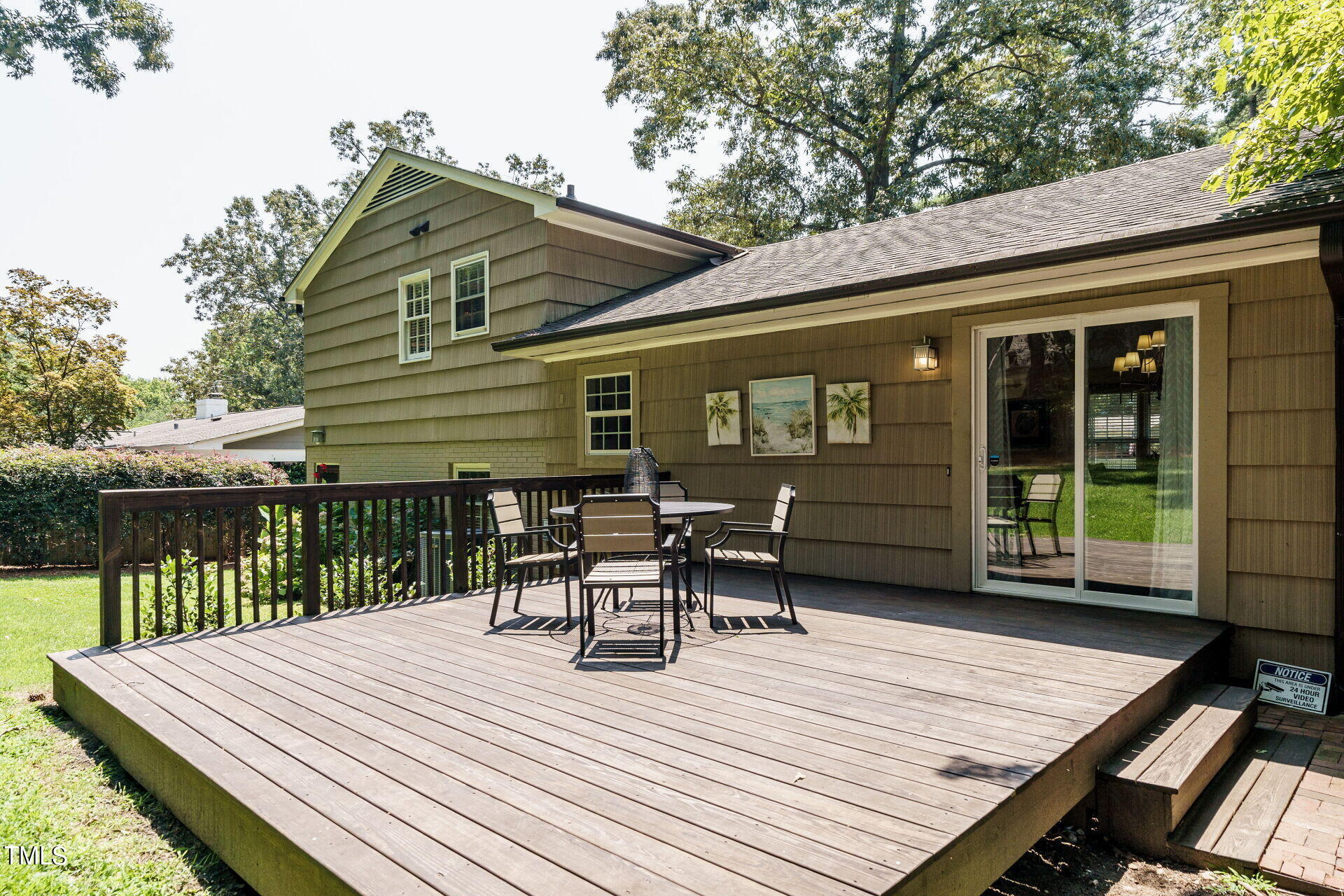 318 Glen Valley Road Raleigh, NC 27609 - Photo 34 of 39 a view of a patio with table and chairs with wooden floor and fence