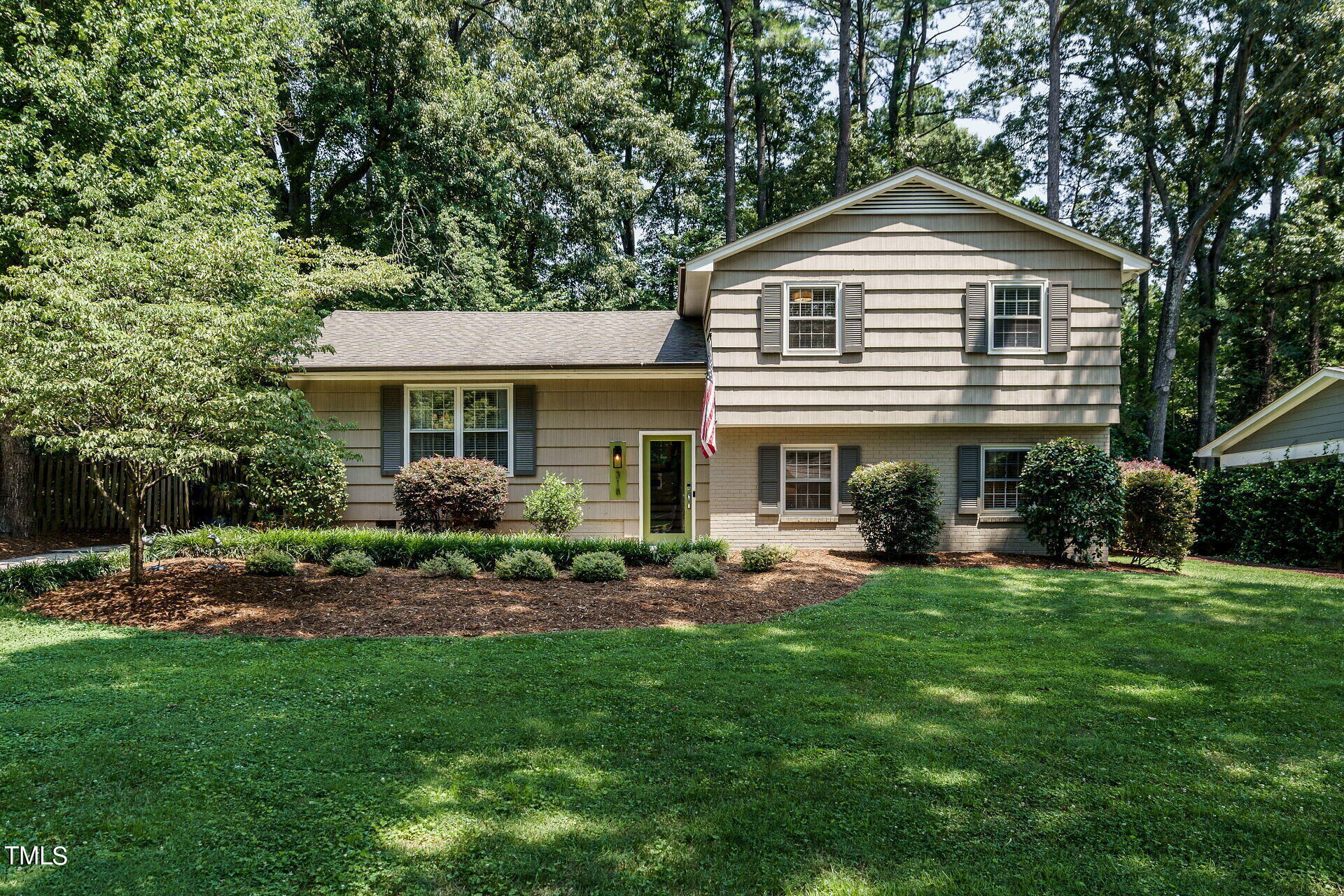 318 Glen Valley Road Raleigh, NC 27609 - Photo 37 of 39 a front view of a house with a garden