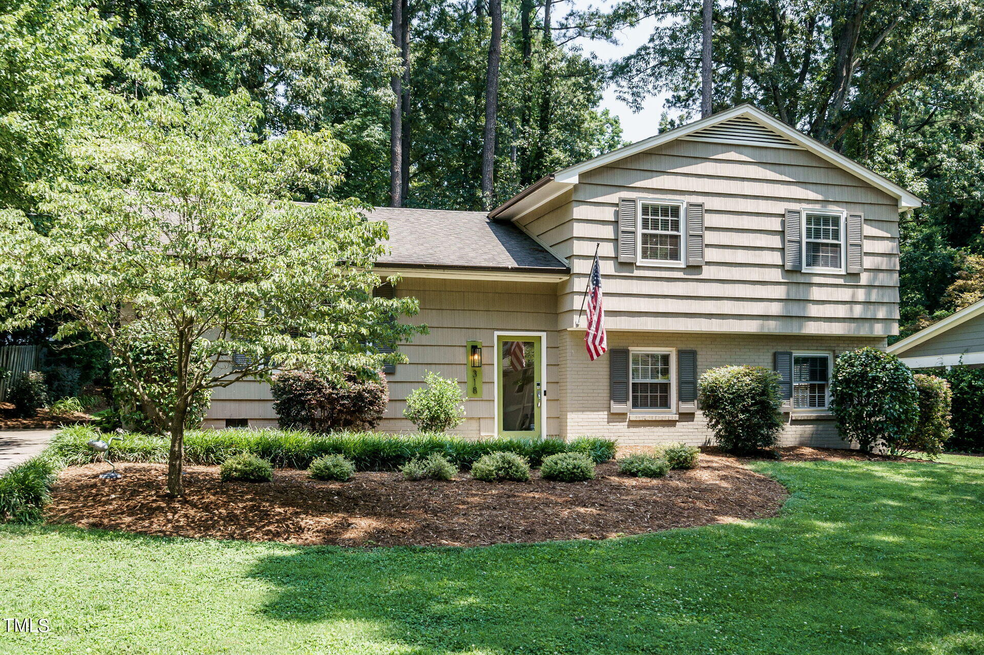318 Glen Valley Road Raleigh, NC 27609 - Photo 38 of 39 a front view of a house with a yard and trees