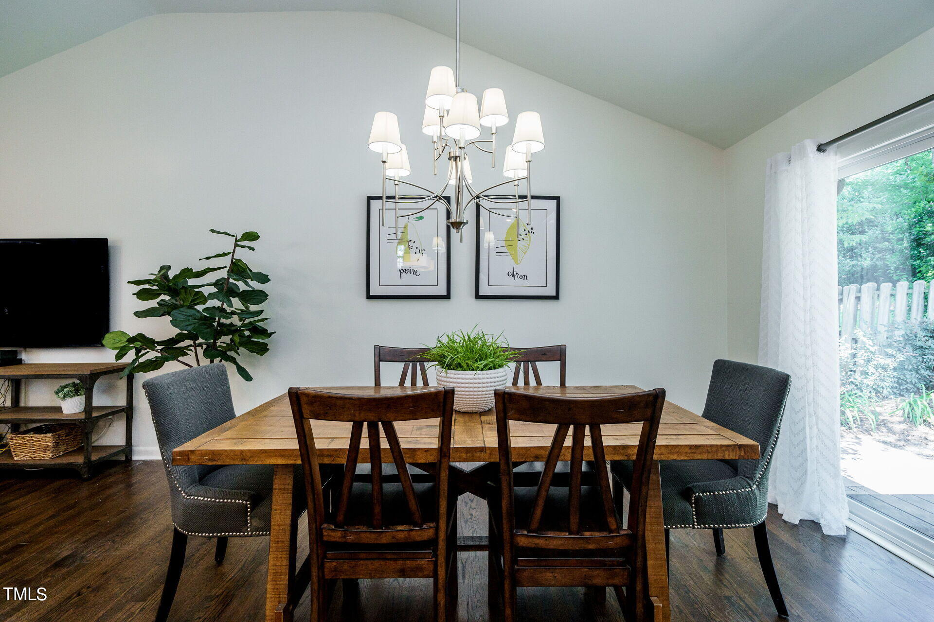 318 Glen Valley Road Raleigh, NC 27609 - Photo 7 of 39 a view of a dining room with furniture and wooden floor