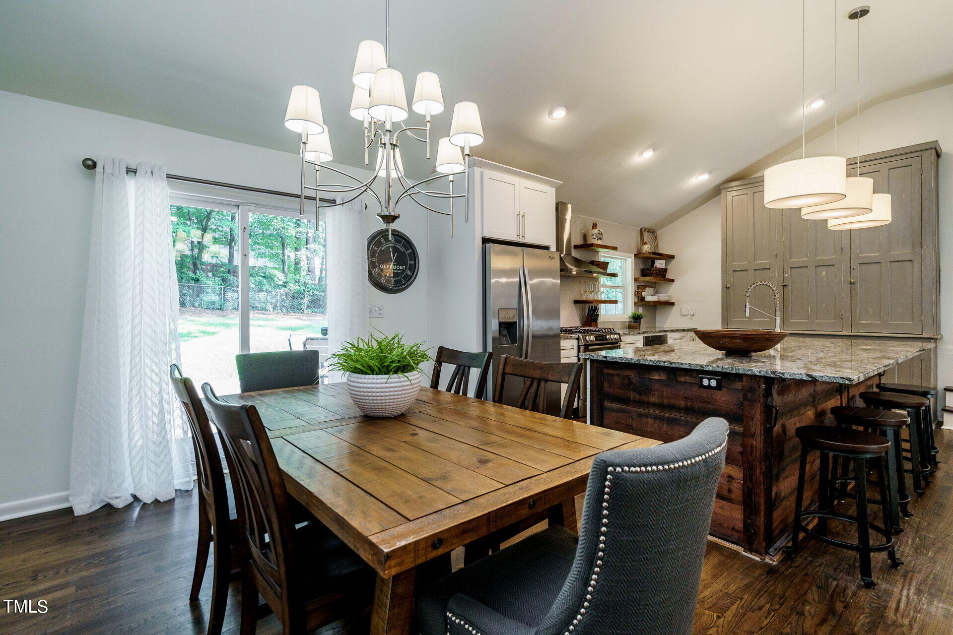 318 Glen Valley Road Raleigh, NC 27609 - Photo 8 of 39 a view of a dining room with furniture window and wooden floor