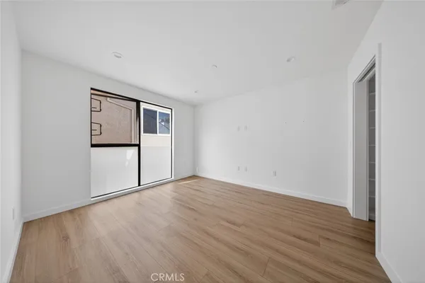 a bathroom with a double vanity sink toilet mirror and bathtub