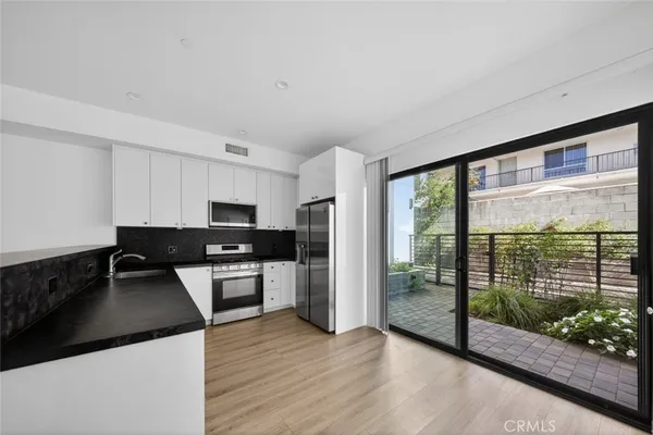 a kitchen with a large window in it and kitchen island